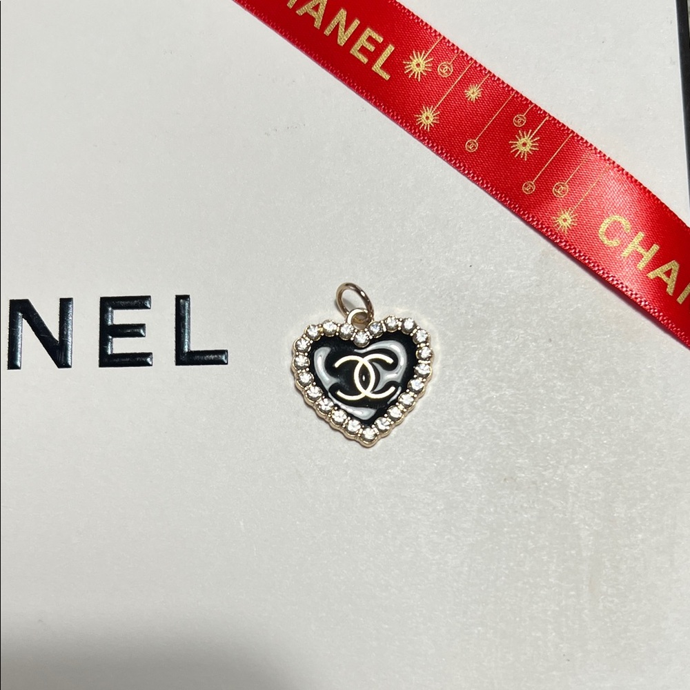 CHANEL Black and Gold heart crystal pendant